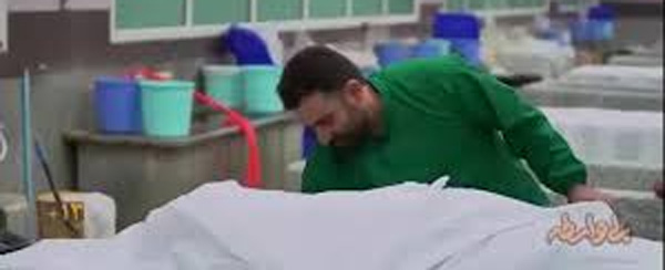 کفن کردن محمد دلاوری